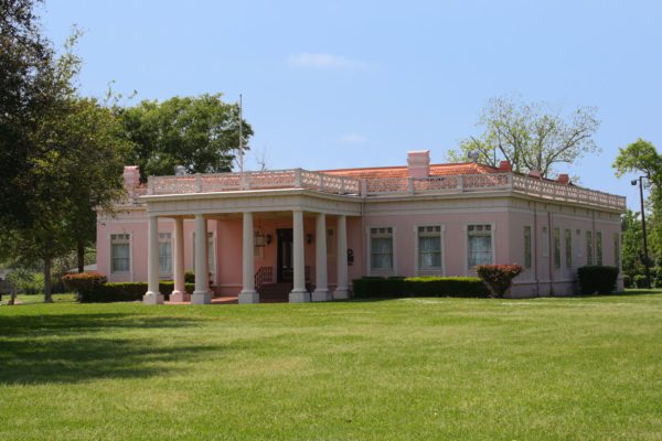 The pink historic home on Lakeshore Drive