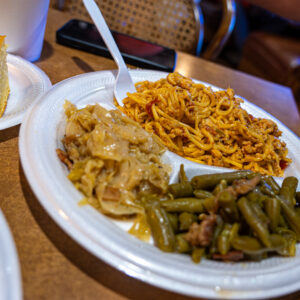 Bobby's Homestyle Cooking in Nederland, TX casual comfort food plate of chicken spaghetti, green beans and cabbage