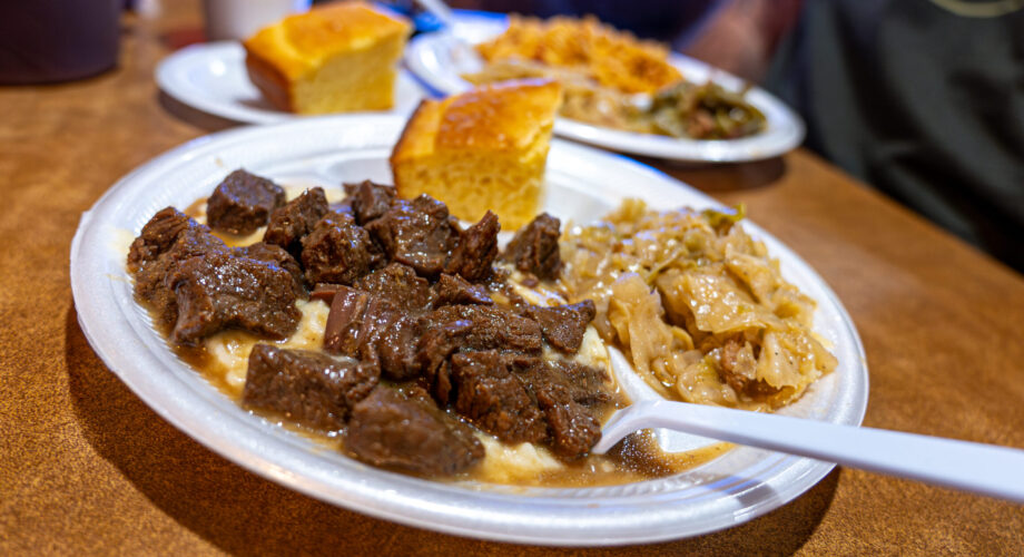 Bobby's Homestyle Cooking in Nederland, TX casual comfort food plate of beef tips, mashed potatoes and gravy with cornbread