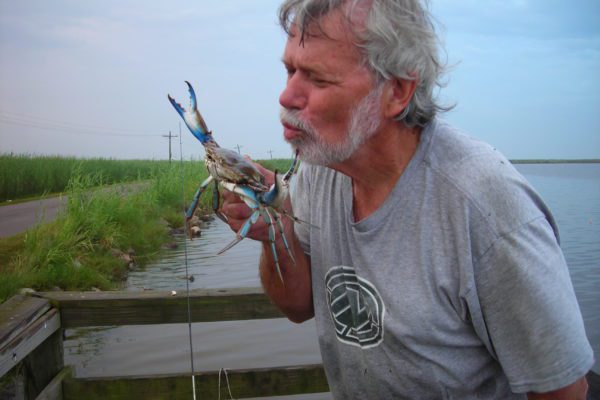 Jim kissing a crab
