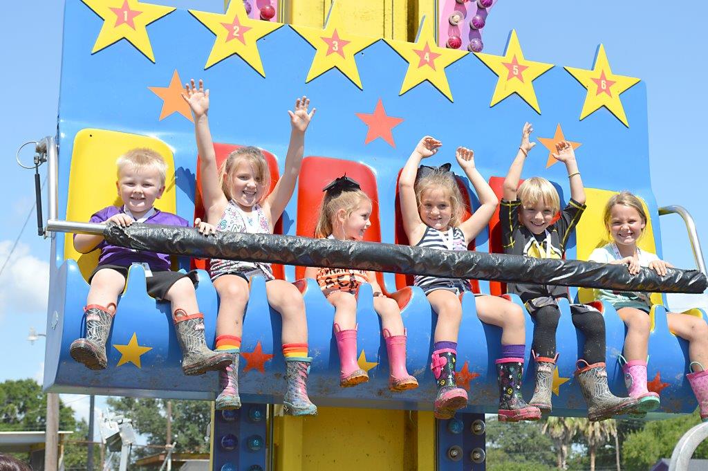 Kids enjoying a carnival ride