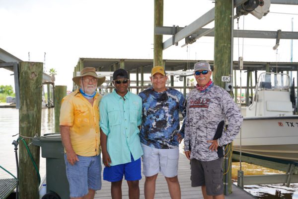 group of guys at a marina in port arthur, texas