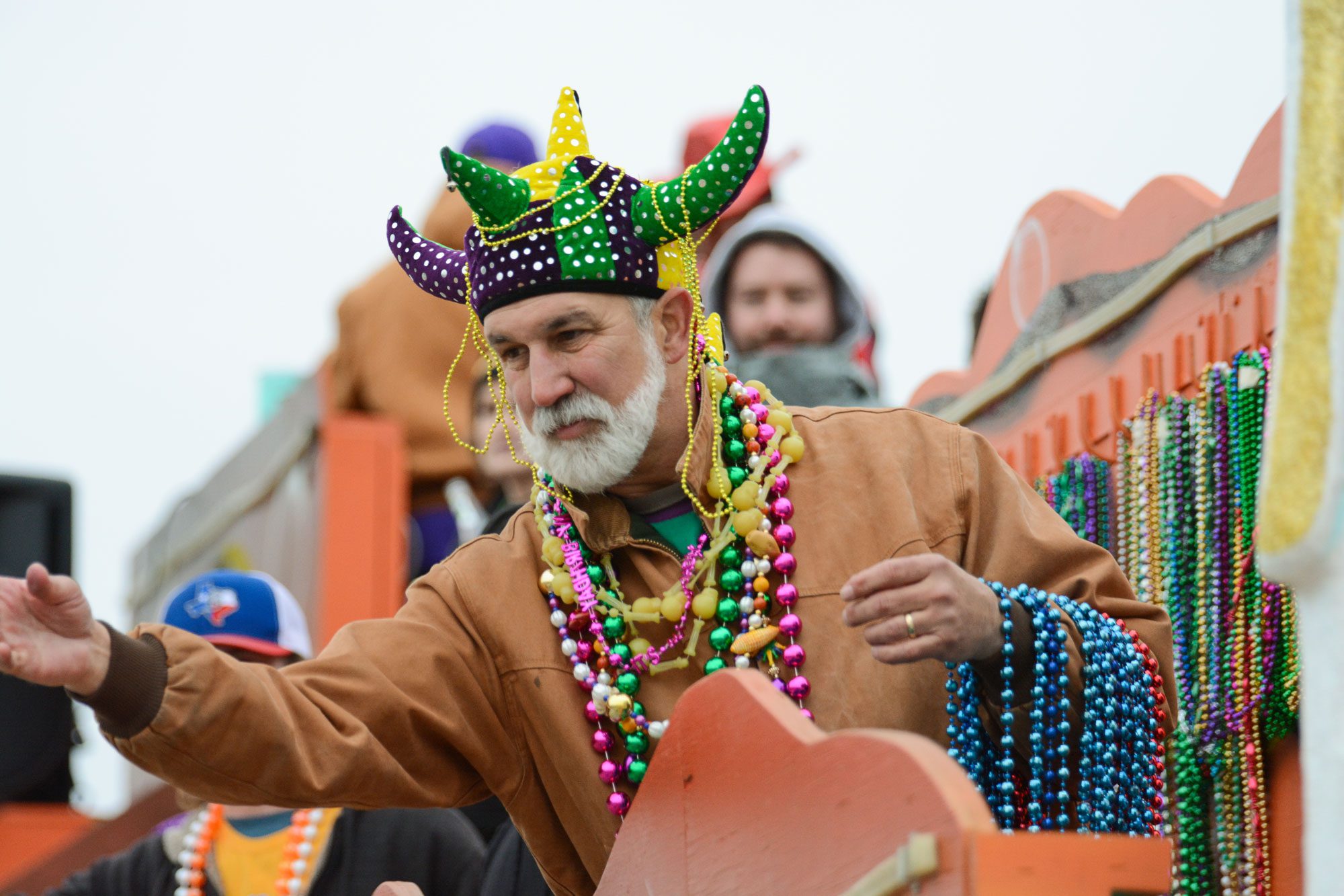 man riding float in parade