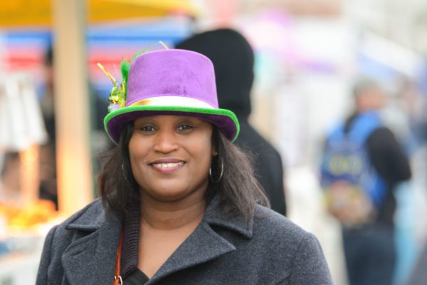 Woman in hat smiling for camera