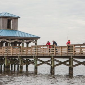 people fishing off the pier