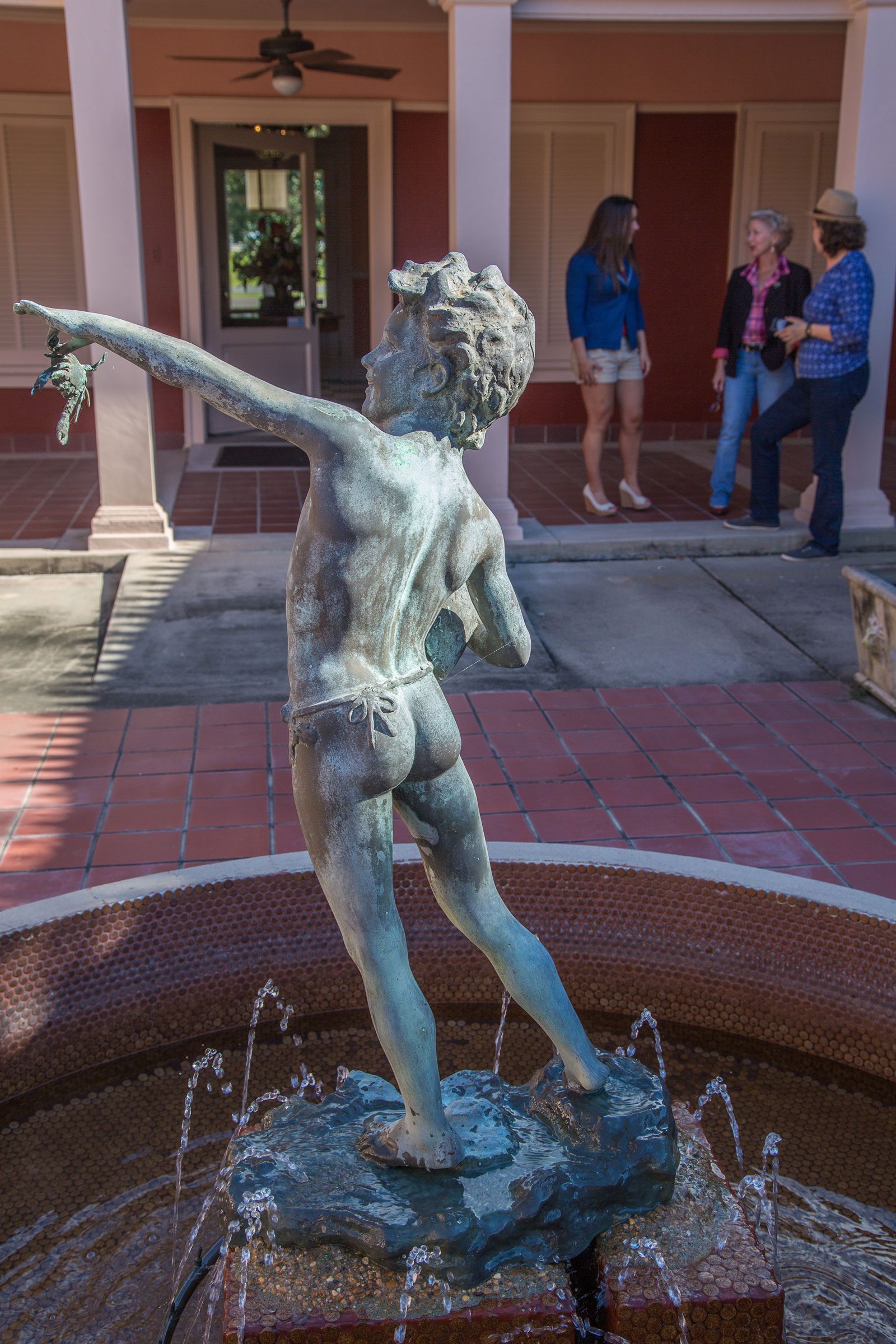 Pompeiian Villa statue and visitors
