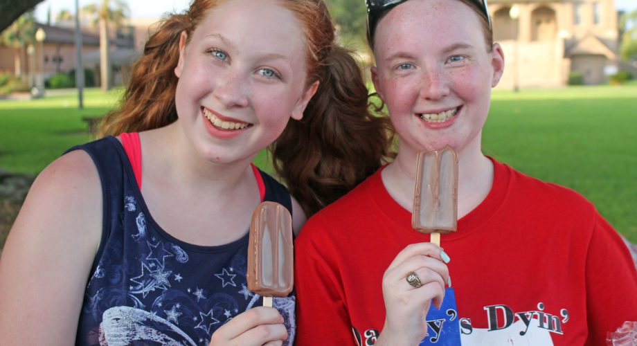 two girls eating chocolate ice cream