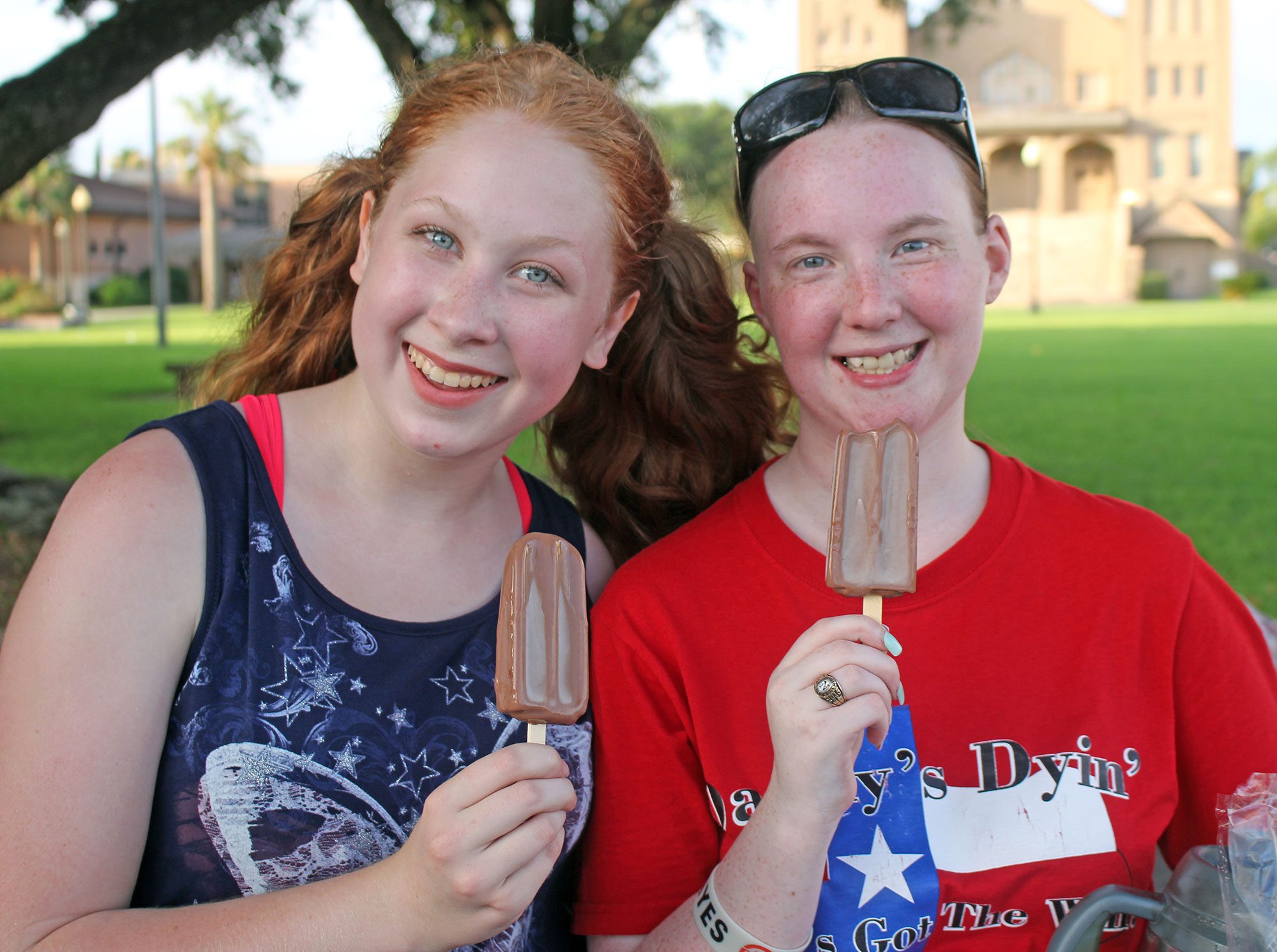 two girls eating chocolate ice cream