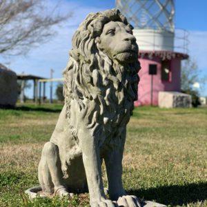 Lion Statue with lighthouse in the background