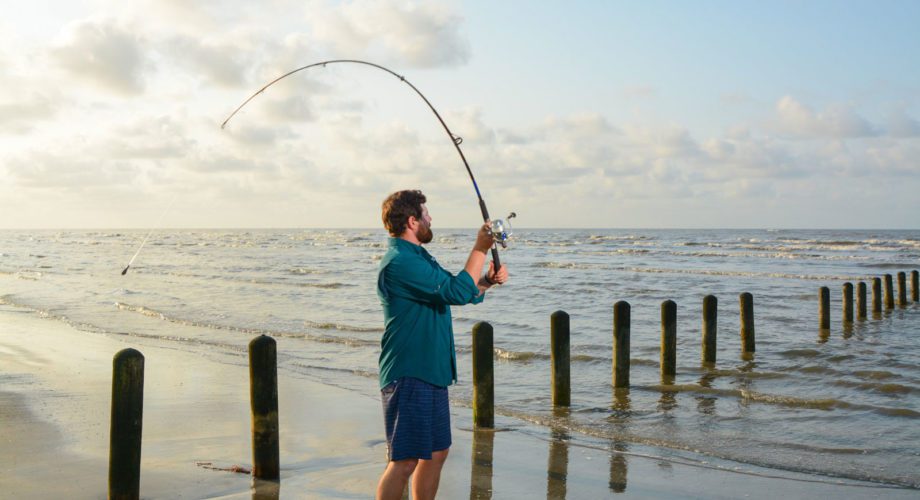 Man casting a line into the Gulf of Mexico