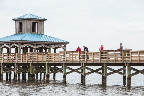 people fishing on the pier