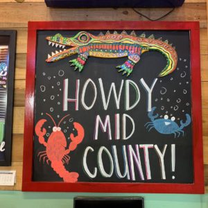 howdy mid county sign