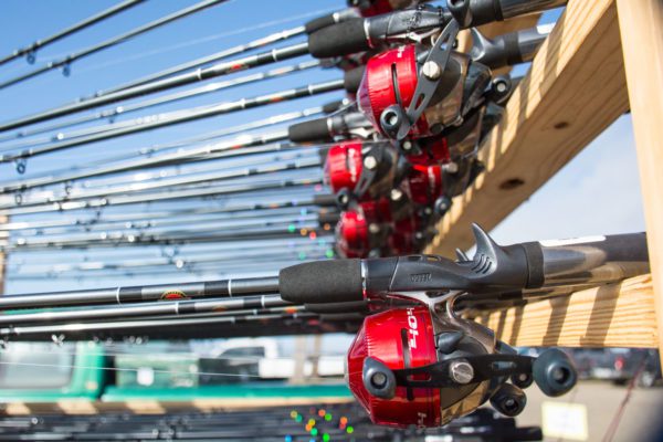 rack of red rod and reels