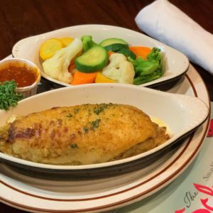 fish and veggies with menu and napkin