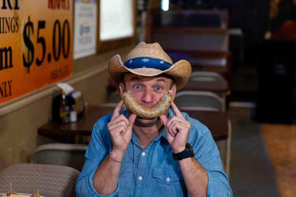 chet with the daytripper smiles with boudain at the schooner restaurant near port arthur texas