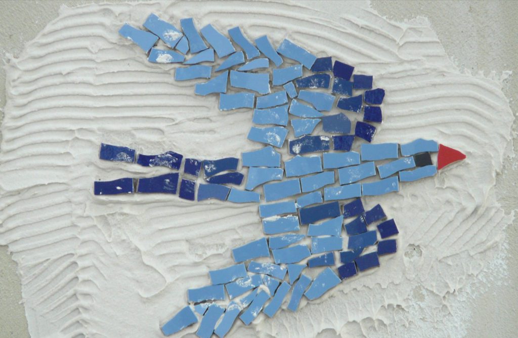 Blue tiles that make up a bird