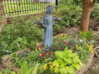 Garden statue with raised bed.