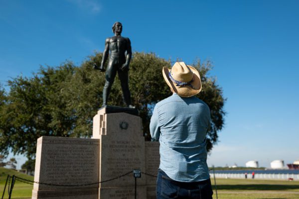 man enjoying statue