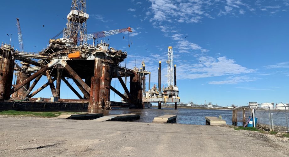 boat launch slips and historic oil rig in port arthur