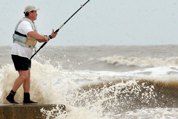 man fishing the jetties in port arthur texas