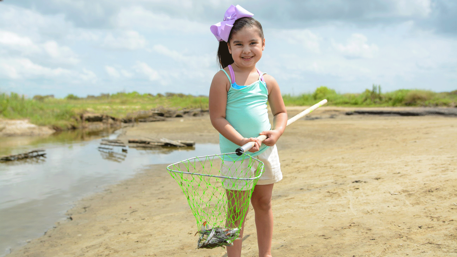 little girl crabbing at sea rim state park in port arthur