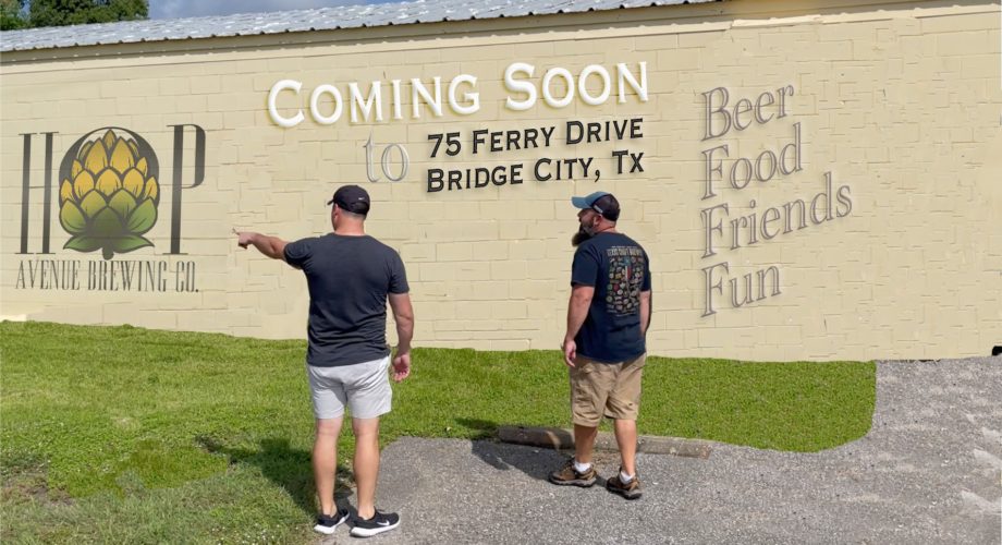 two men standing in front of a brewery in southeast texas