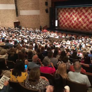 large audience seated inside the lutcher theatre in orange texas