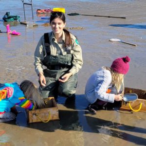 woman assisting children at sea rim state park