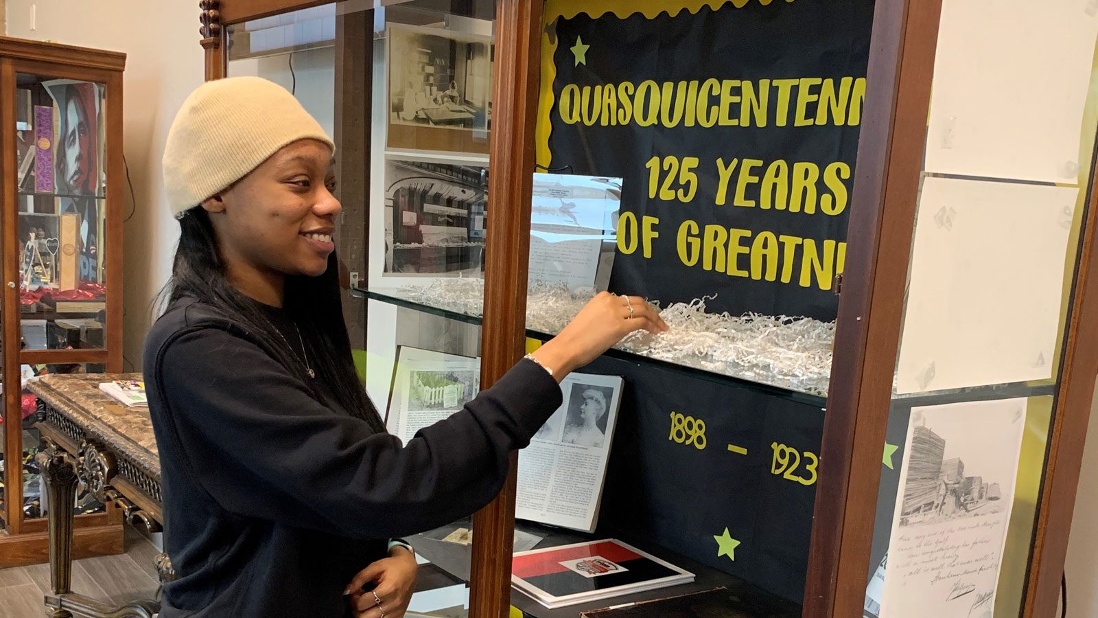 woman looks at quasquicentennial display at the public library in port arthur, texas
