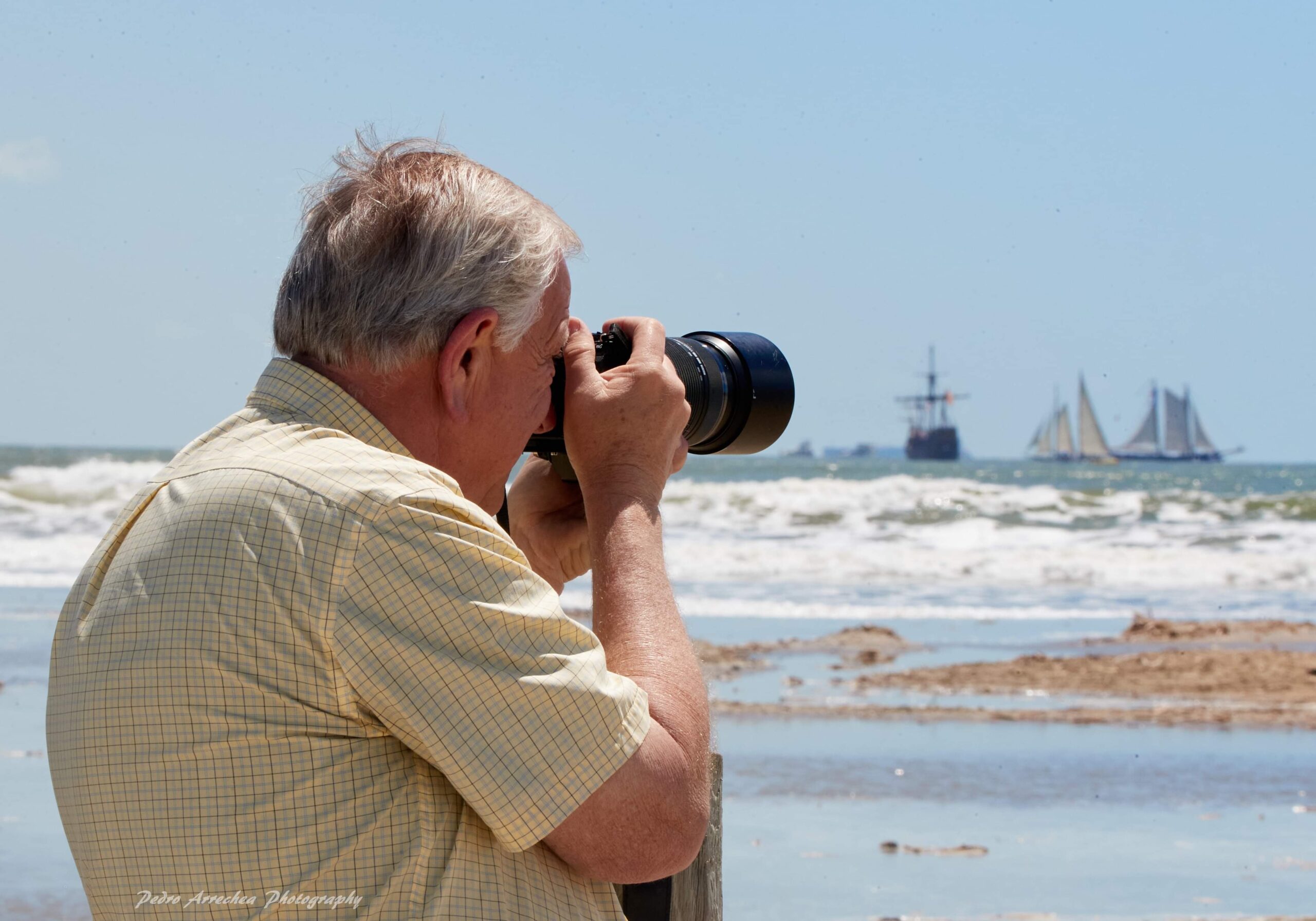 man taking a photo at the beach in port arthur texas