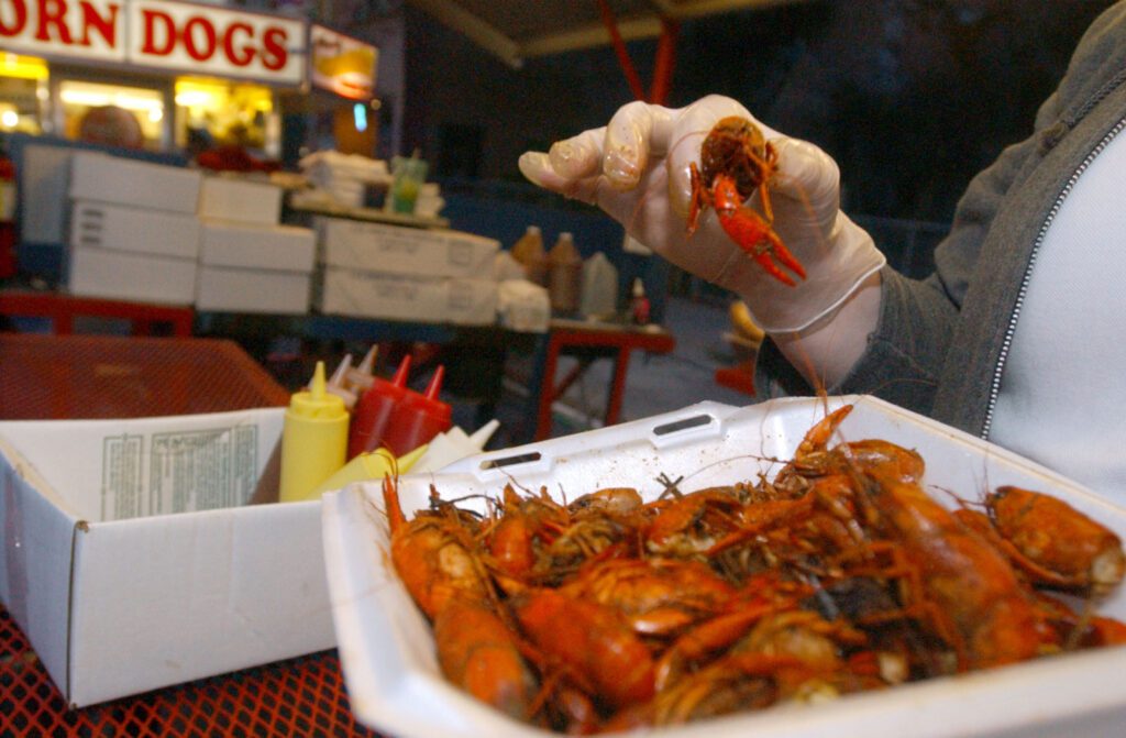 hand holding crawfish in port arthur texas