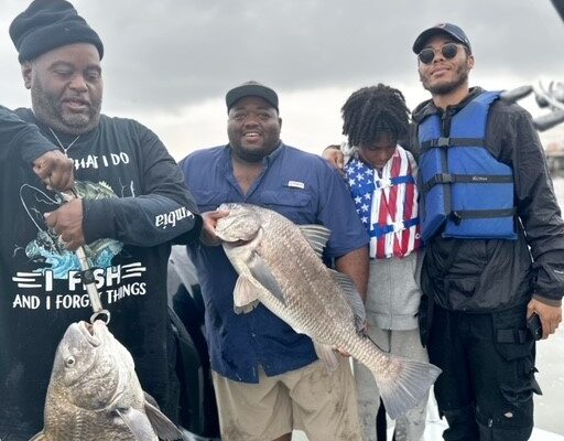 a group of men showing off their fishing catch on a boat in sabine lake port arthur texas