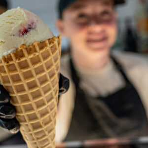Legendairy Gelato Cafe in Nederland Texas worker serves gelato cone