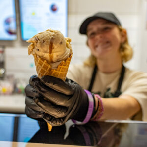 Legendairy Gelato Cafe in Nederland Texas worker serves gelato cone