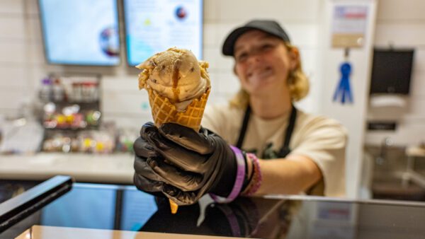 Legendairy Gelato Cafe in Nederland Texas worker serves gelato cone