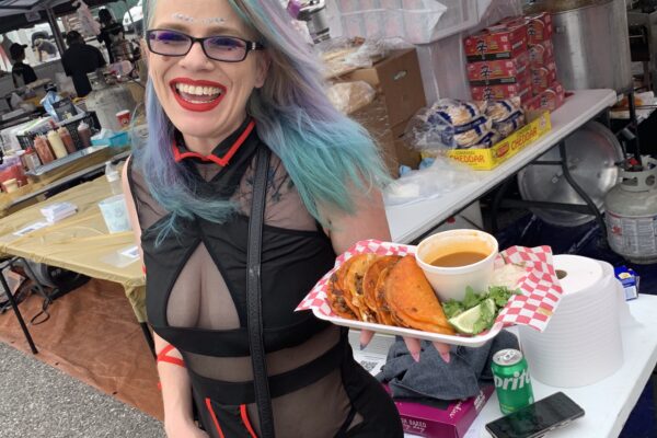 Girl with green and purple hair is cosplay with food at Otaku Cherry Blossom Festival at Central Mall.