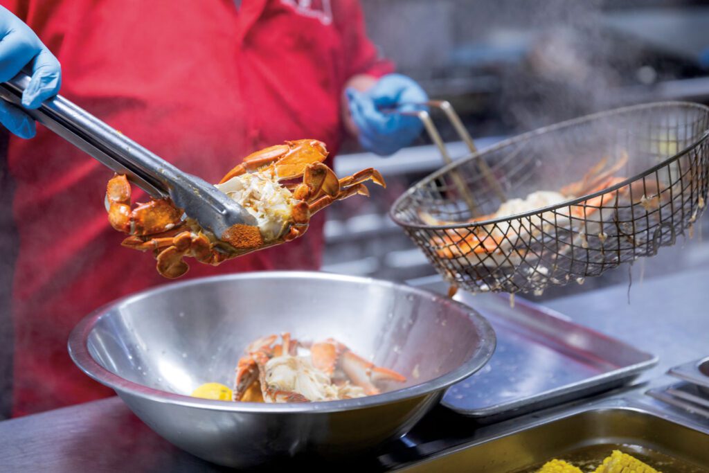 hands cooking crabs in port arthur texas