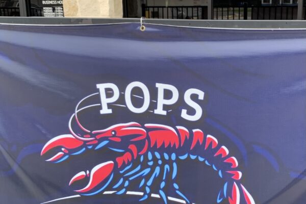 Pops Boil 'N Geaux in Groves, flag outside building, Groves Texas
