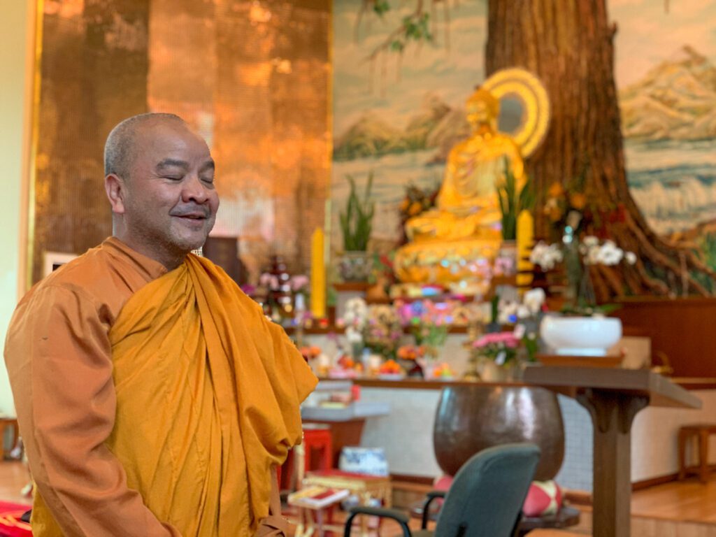 temple monk meditates inside buu mon buddhist temple in port arthur texas
