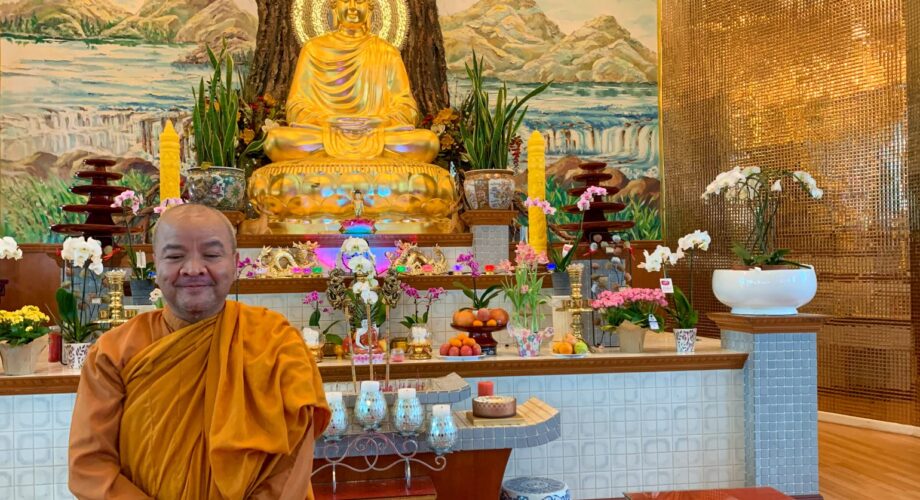 monk standing inside buu mon buddhist temple in port arthur texas