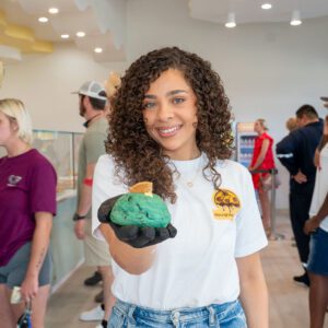 girl holding a cookie at doughlicious in port arthur