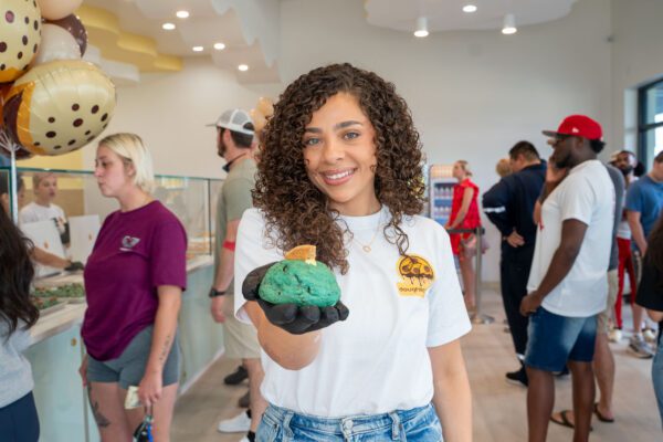 girl holding a cookie at doughlicious in port arthur