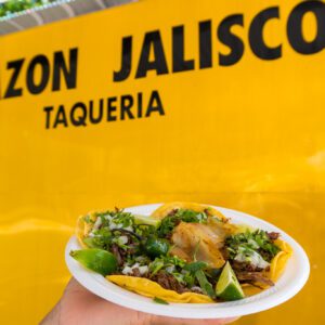 hand holding tacos