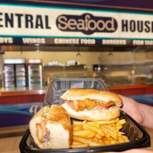 hand holding sandwich